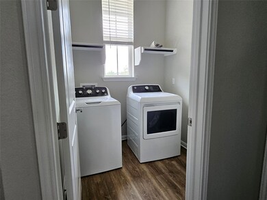 Laundry room featuring separate washer and dryer 