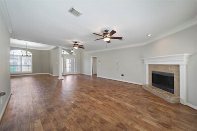 View of the living room looking back toward the front door.