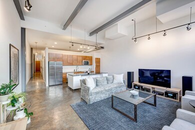 Spacious and stylish living area featuring polishe