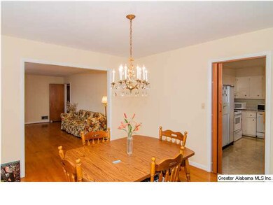 Formal dining room flows to kitchen.