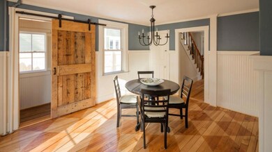 Dining area open to half bath and entry
