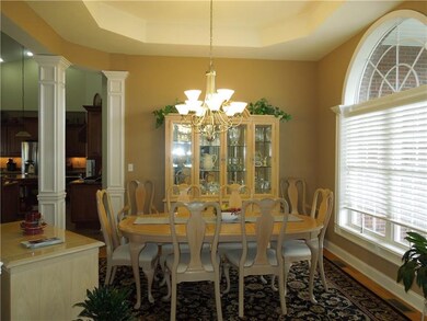 Elegant Dining room with Tray ceilings, picture wi