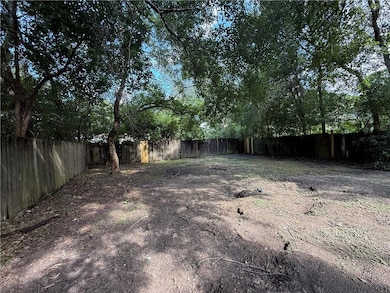 View of fenced backyard