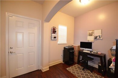 Entry Foyer With Hardwood Flooring Open To Study A