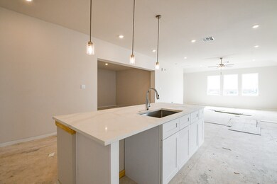 The pendant lights above the counter create a grea
