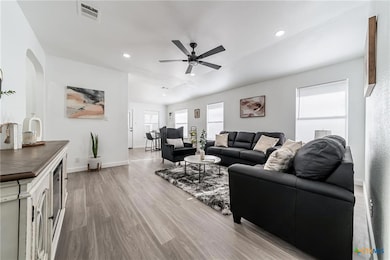 Living room featuring light wood-type flooring, r