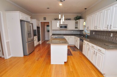The gourmet kitchen is accented with tons of cabin