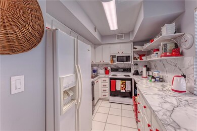 White and bright kitchen with lots of storage