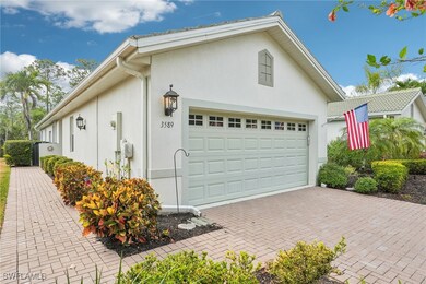 Garage featuring decorative driveway