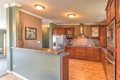 Open concept kitchen, stainless steel appliances a