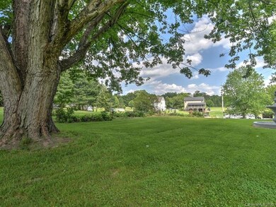 Property line runs horizontally between fountain a