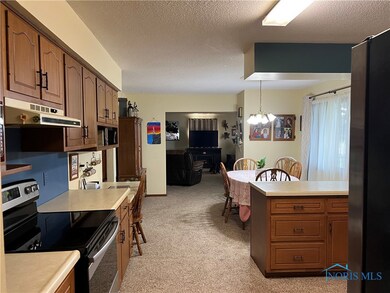 View of the kitchen/dining/living room from the ut
