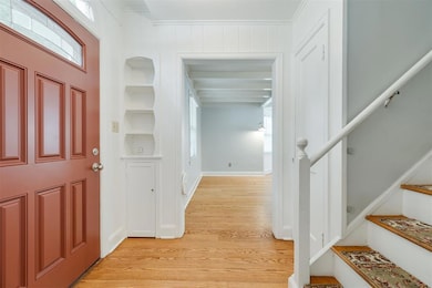 Foyer featuring a wealth of natural light, beamed 