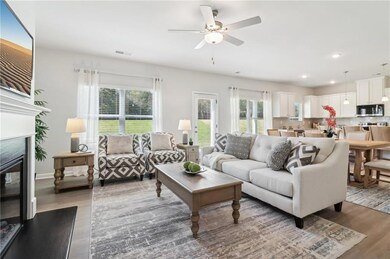 Living room with hardwood / wood-style flooring an
