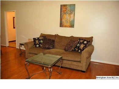 The open living room flows into the kitchen and di