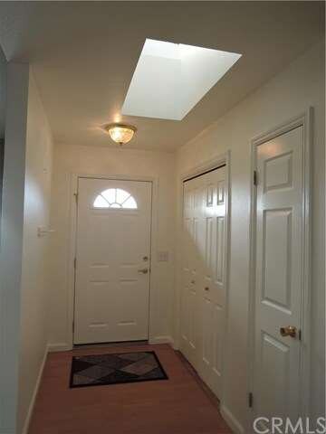 Skylight brightens the front entry coat closet and