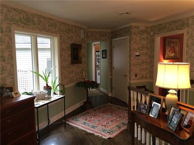 Gorgeous entry foyer accented by beautiful hardwoo