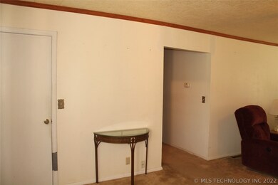 Living room with view of Entry closet