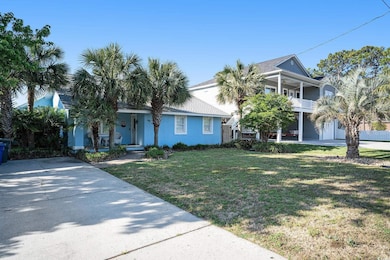 View of front of property with a front lawn, a balcony, and covered porch