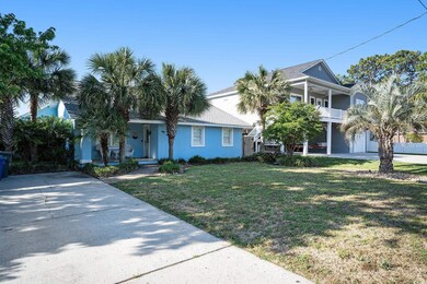 View of front of property with a front lawn, a bal