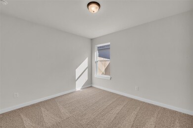 Unfurnished room featuring carpet flooring and ba