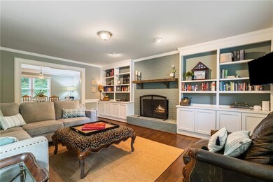 formal living room or possible office with built in bookcases