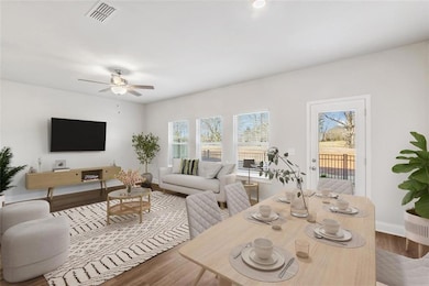 Living room with hardwood / wood-style floors and 