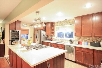 Quartz slab island.  Jenn Air 5 burner cook top.  