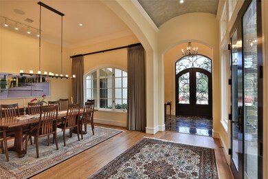 So many architectural details to this beautiful home. Graceful arches in many areas, barrel ceiling, French doors and walls of windows