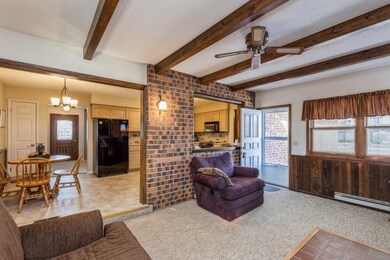 main level family room with beams