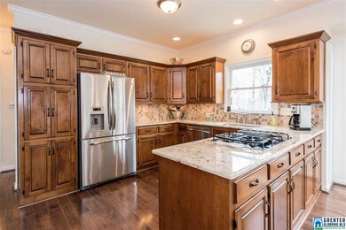 Kitchen boasts gas cooktop, double ovens, built-in