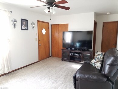 Newer carpet and tons of light in this living room