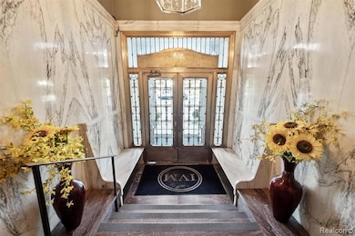 Entryway featuring a chandelier