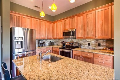 Custom cabinetry, granite countertops and stylish 