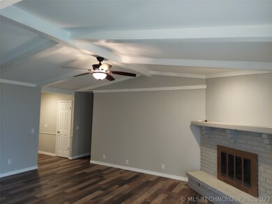 Family room with new wood-looking tile floors. New