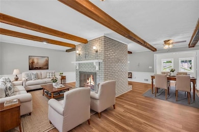 Living room dining space virtually staged to show use of space!