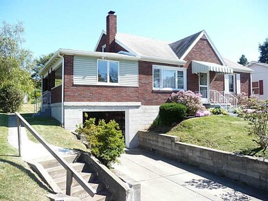 Exterior Front. Level concrete drive to the garage