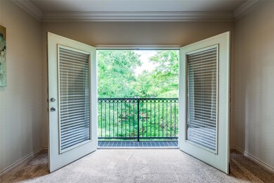 living room with french doors to step-out balcony,