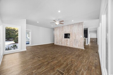 Unfurnished living room with dark hardwood / wood-