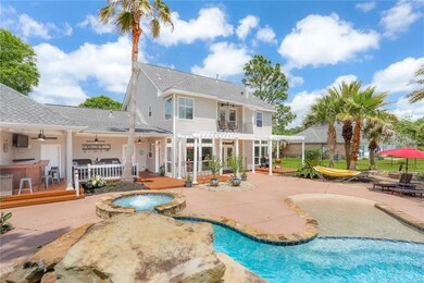 Backyard oasis with heated pool, outdoor bar, hiba