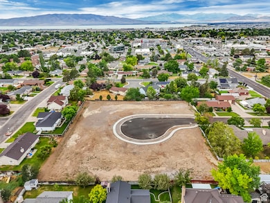 Aerial perspective of suburban area with a mountainous background