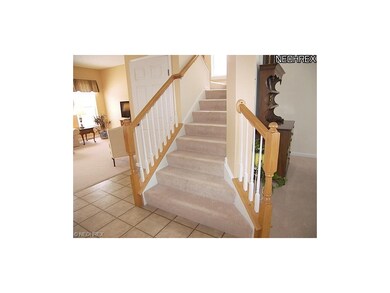 The foyer opens to the formal living room