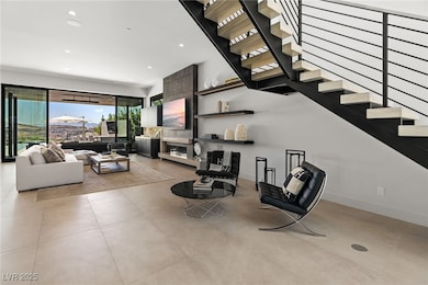 Living area with stairs, recessed lighting, basebo