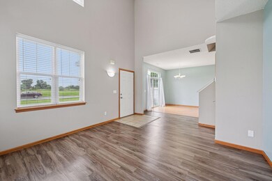The spacious living room is open to the informal dining room.