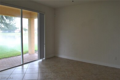 Spare room with tile patterned floors and baseboards
