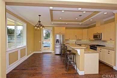 Hand distressed engineered wood flooring in entry,