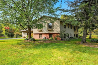 Charming curb appeal on a wooded, low-traffic street.