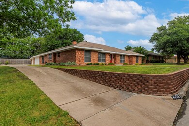 Long driveway to a 3-car garage on the side of the