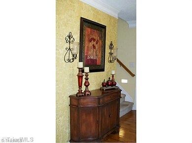 Entry. Inviting entry with hardwoods and faux painted wall.