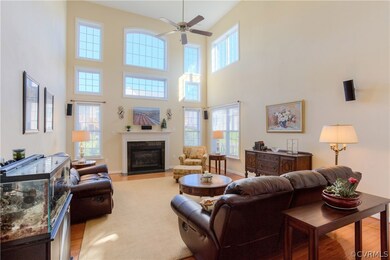 2 Story Family Room with lots of light and gas fireplace.